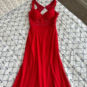 Red prom dress in size 2 has a slit in the front